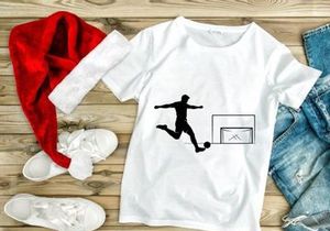 Soccer player kicking ball into goal in a dynamic motion