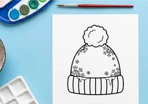 Topi beanie musim dingin dengan pola bunga salju dan pom pom, ilustrasi seni garis hitam putih.