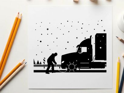 Silhouette of a man fixing a semi truck on a snowy road