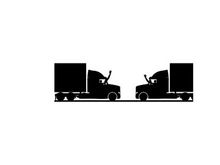 Silhouette of two semi trucks facing each other on a road