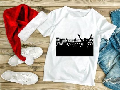 Silhouette of a crowd of people with raised hands in a stadium