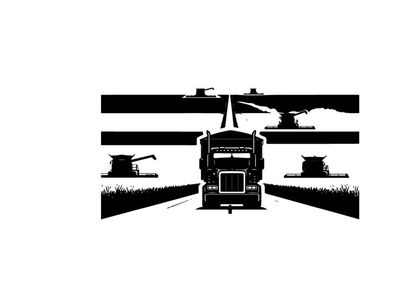 Truck driving down a highway in silhouette at dusk