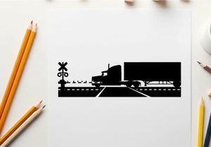 Truck silhouette crossing railroad tracks with warning signs