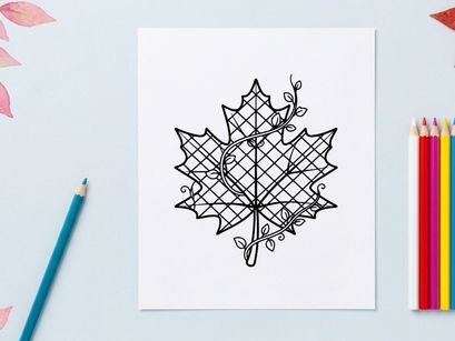 Decorative autumn leaf ornament with intricate wire design. Elegant seasonal decor for home or craft projects.