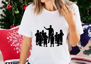 A teacher standing and pointing while surrounded by a group of attentive young students