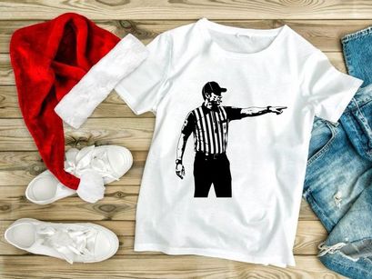 A black and white image of a referee pointing to the right in a striped shirt