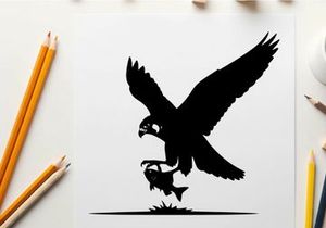 Silhouette of an eagle catching a fish in mid air
