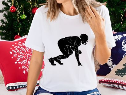 A black silhouette of a male athlete in a sprinting position ready to run fast