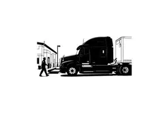 Silhouette of a semi truck parked beside a building with a pedestrian