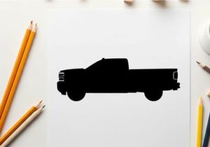 Silhouette of a pickup truck against a white background