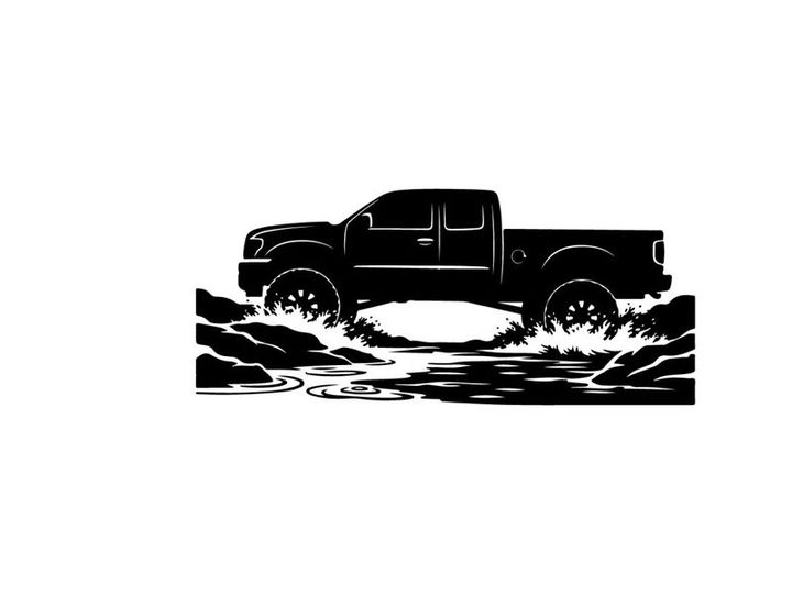 Silhouette of a pickup truck driving through water