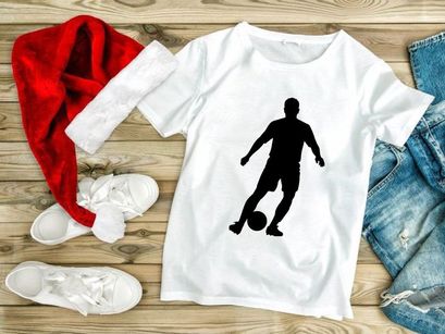 Soccer player kicking a ball in action