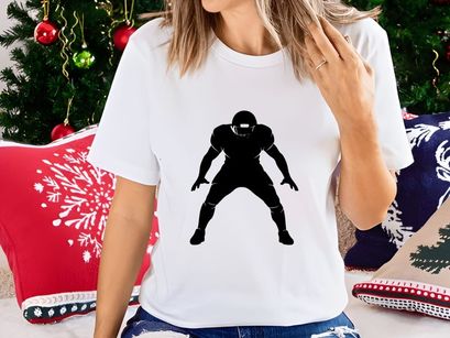 American football player in defensive stance silhouette