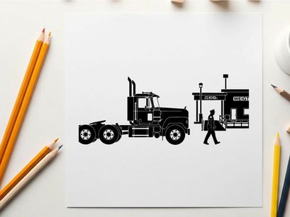 Silhouette of a man walking next to a semi truck and building