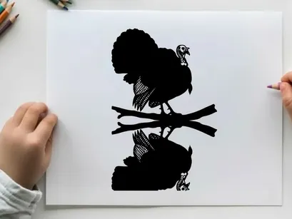 Silhouette of a turkey perched on branches with reflection