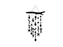 Silhouette of a driftwood wind chime with starfish and sea inspired shapes