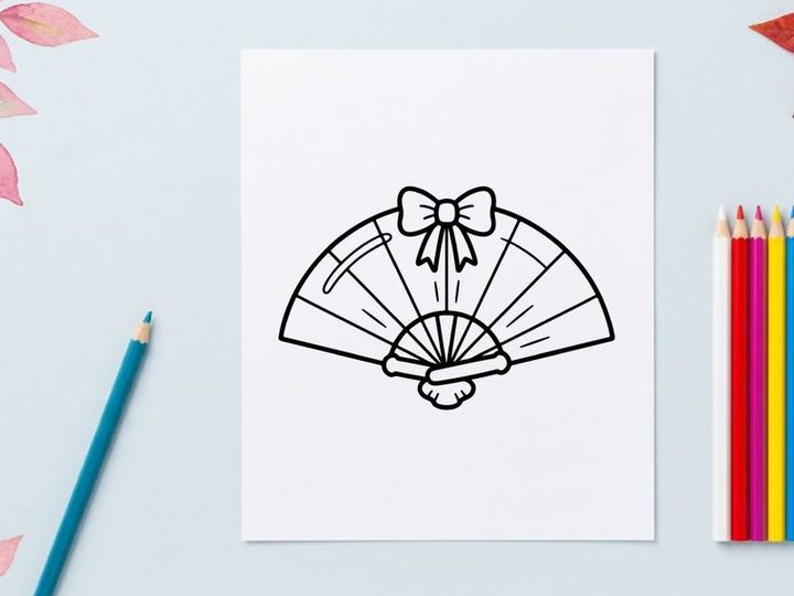 Hand-drawn Halloween paper fan with black bow. Vintage-style decorative folding fan featuring a spooky bow tie design.