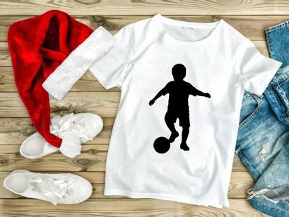 Silhouette of a boy playing soccer with a ball on a white background