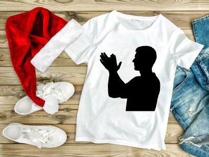 A man in silhouette with hands raised in a gesture of prayer or supplication