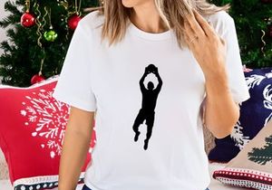 A silhouette of a person jumping to dunk a basketball with athletic motion