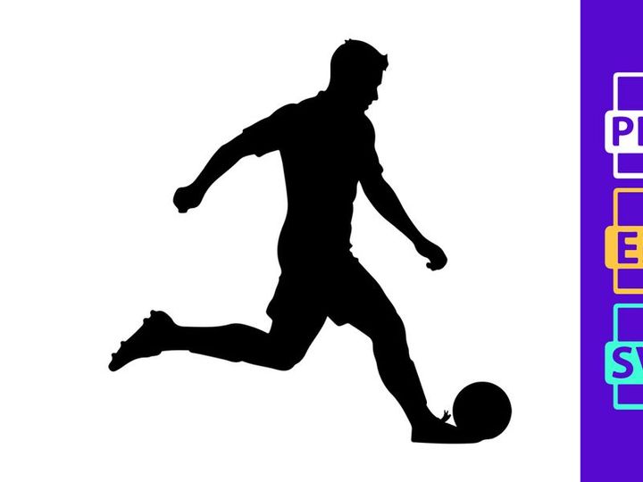Silhouette of a soccer player kicking a ball in motion