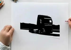 Silhouette of a large truck driving on a road