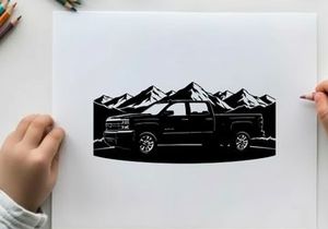 Silhouette of a pickup truck in front of mountains