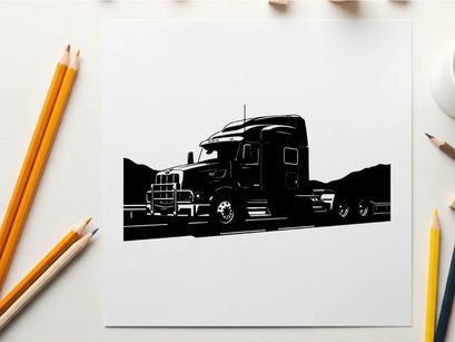Silhouette of a large truck driving on a highway with mountains