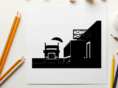 Truck silhouette parked beside a warehouse at sunset