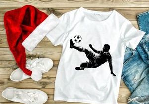 Soccer player in mid air kicking a ball with leg extended