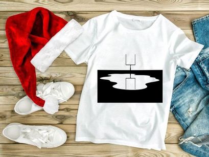 A black and white image of a football goal post reflected in a puddle of water