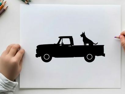 Silhouette of a dog sitting in the back of a pickup truck