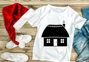 Thatched roof cottage with smoking chimney