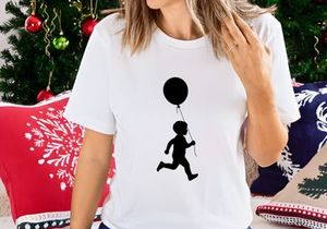 Silhouette of a child running with a balloon, joy, freedom