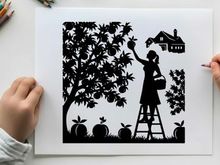Silhouette of a woman picking apples from a tree in an orchard