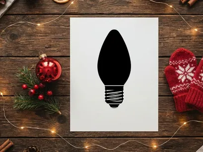 Black silhouette of a Christmas light bulb isolated on a white background