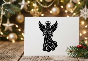 Black silhouette of a praying angel with wings, isolated on a white background.