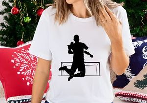A silhouette of a triumphant athlete jumping over a hurdle in a celebratory pose
