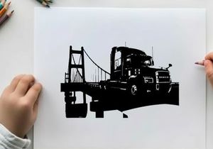 Silhouette of a semi truck driving across a suspension bridge