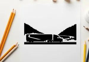 Truck driving through mountains in silhouette