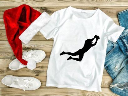 A silhouette of a person jumping up to catch a ball in mid air motion dynamically