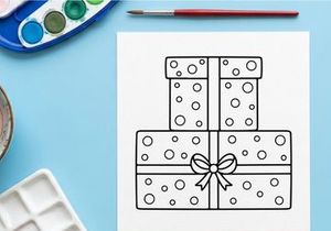 Three stacked Christmas gift boxes with polka dots and decorative bow for holiday celebration