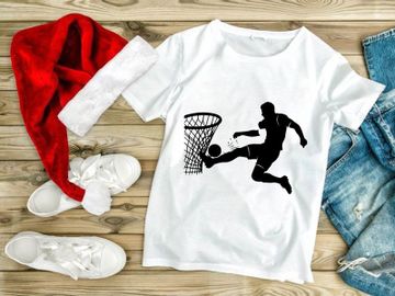 Soccer player kicking ball into basketball hoop in mid air motion silhouette preview picture