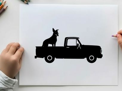 Silhouette of a dog sitting in the back of a pickup truck