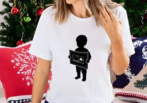 Child Holding Artwork with Shamrock