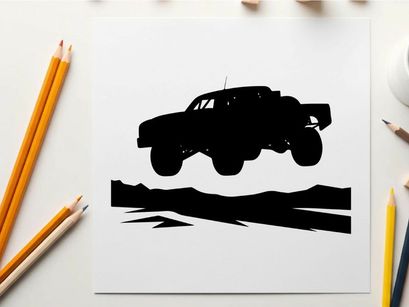 Silhouette of a monster truck in air with large wheels