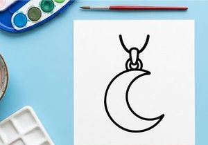 Minimalist crescent moon pendant necklace on white. Elegant celestial jewelry for modern fashion and gothic style.