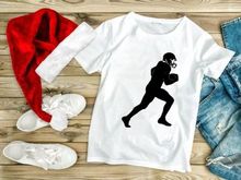 American football player running with ball in hand silhouette