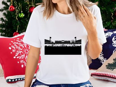 A black and white photograph of an empty sports stadium with spectators