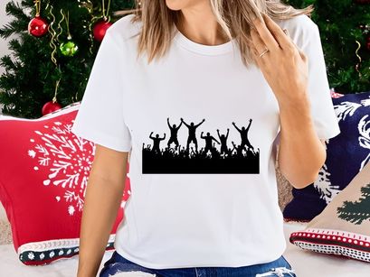 Silhouette of joyful people jumping and celebrating with raised arms in unison together